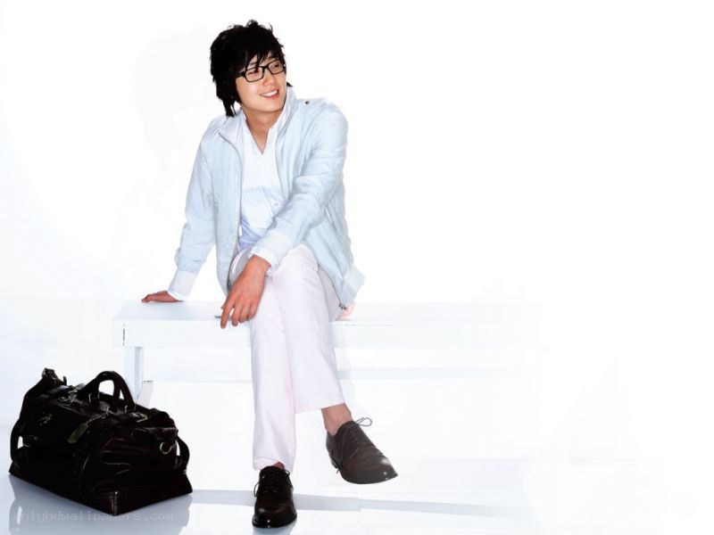 man sitting on white bench
