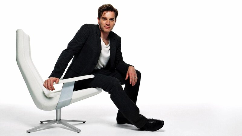 man sitting on white chair