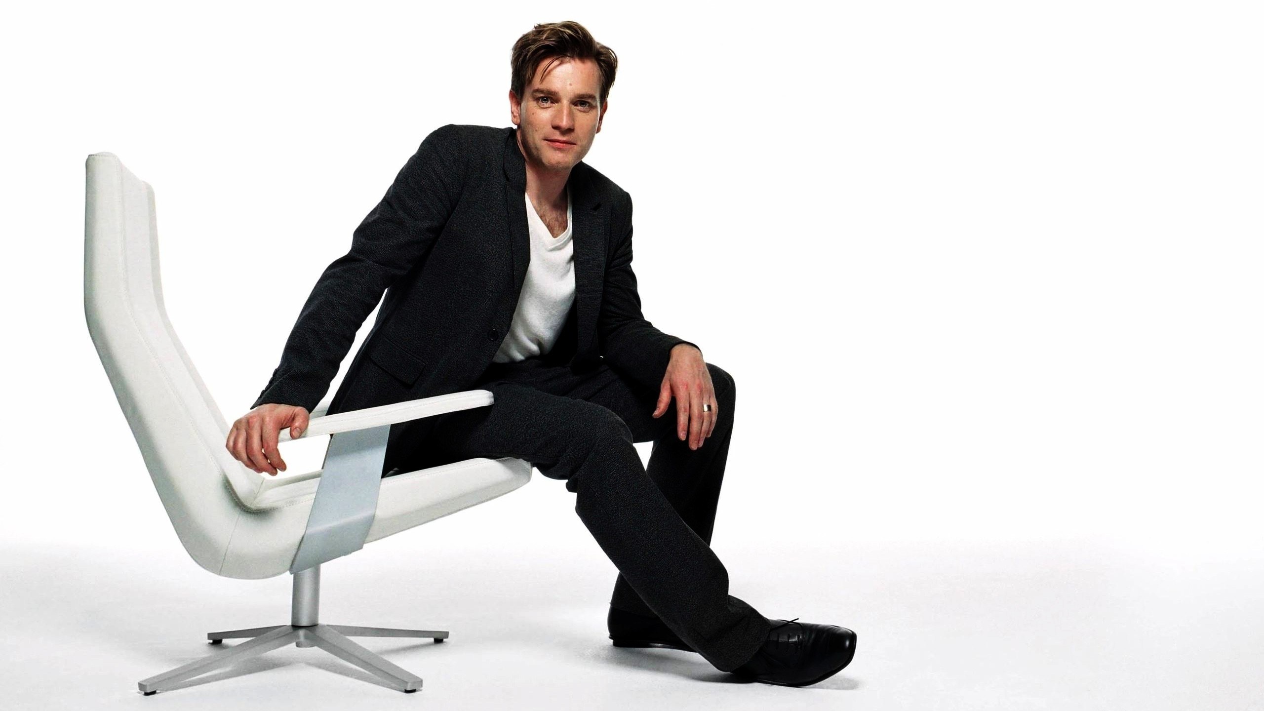 man sitting on white chair