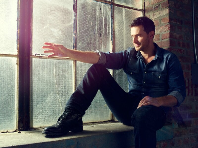 Man Sitting on Windowsill