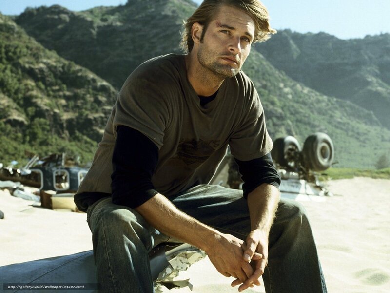 man sitting on wreckage