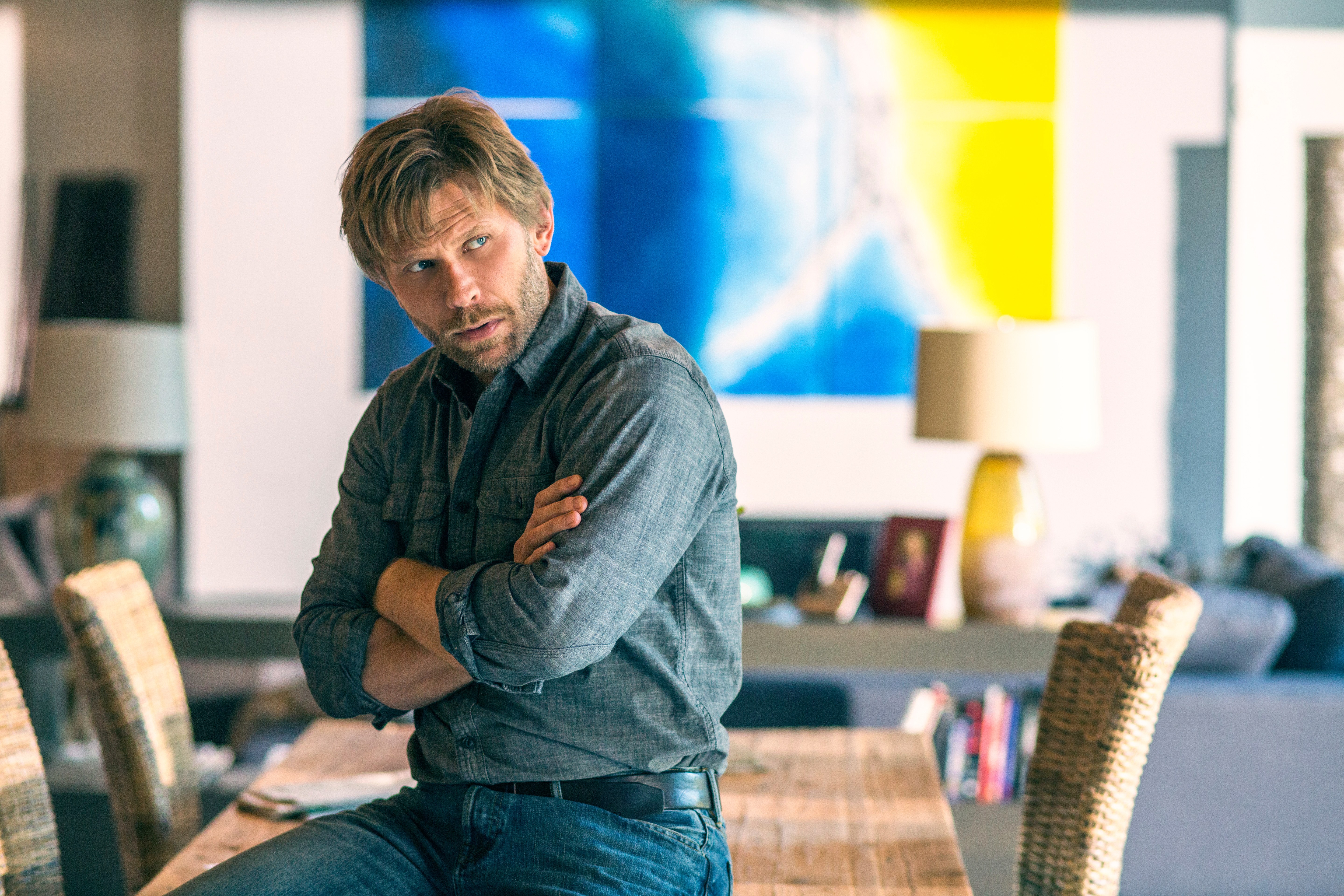 man sitting with arms crossed