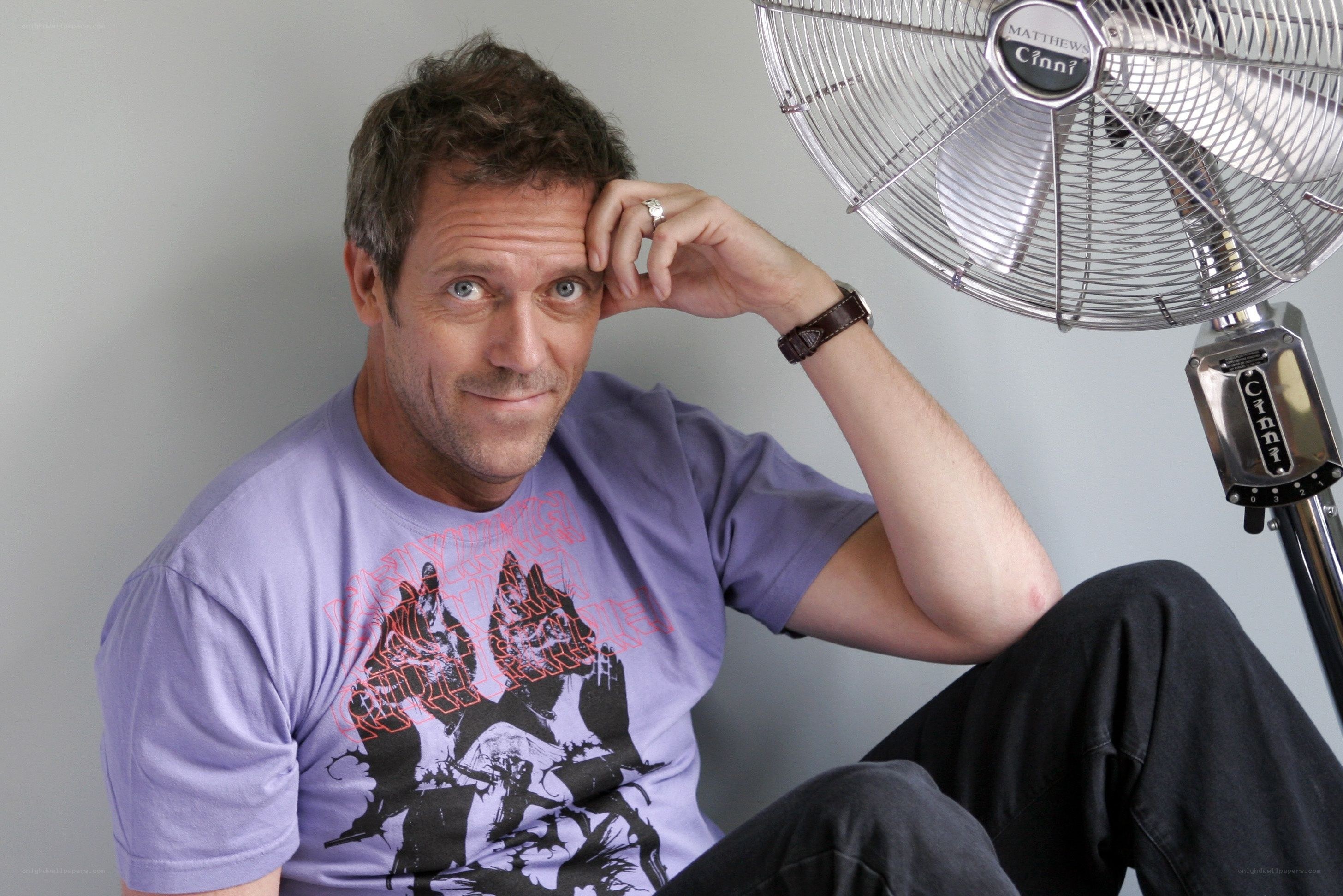 man sitting with fan