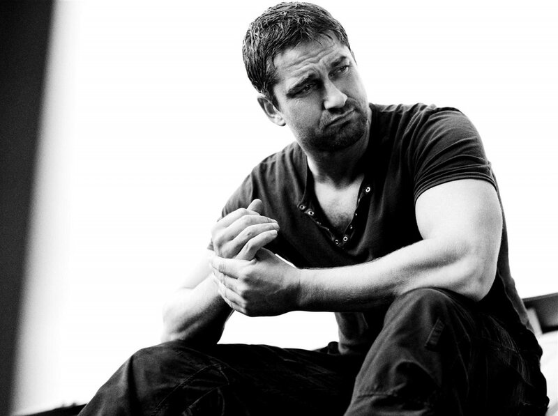 man sitting with hands clasped