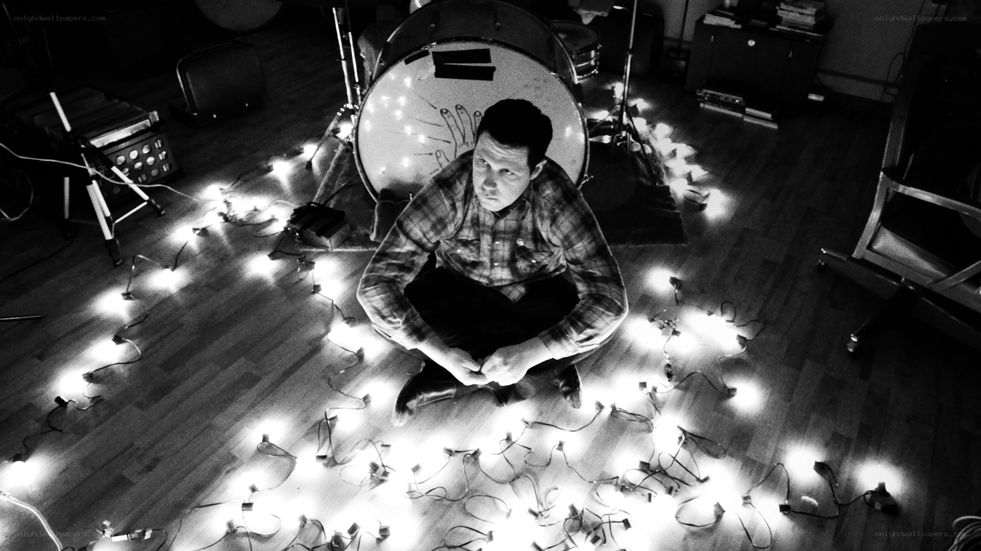 man sitting with lights on floor