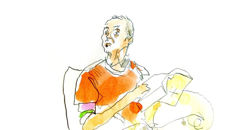 man sitting with papers