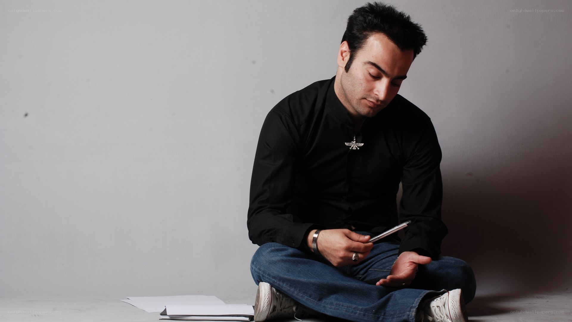 man sitting with phone