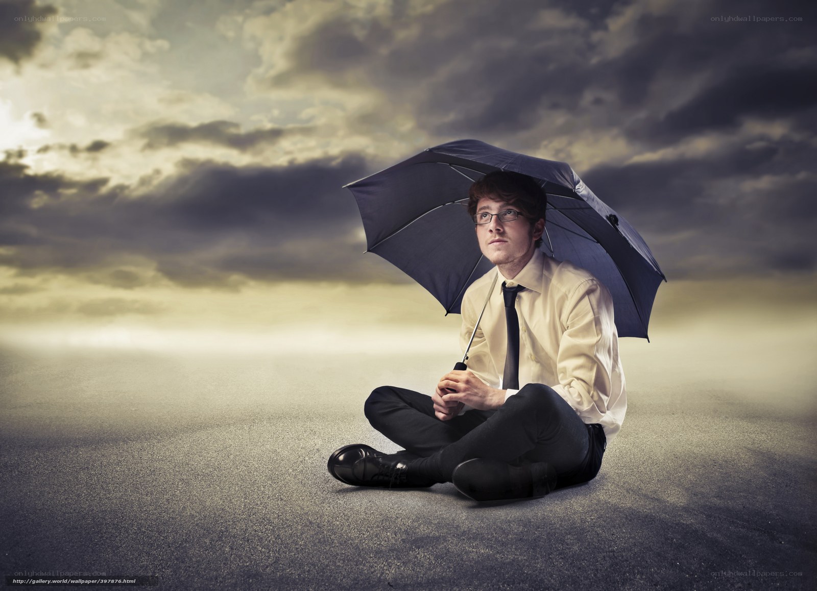 Man sitting with umbrella