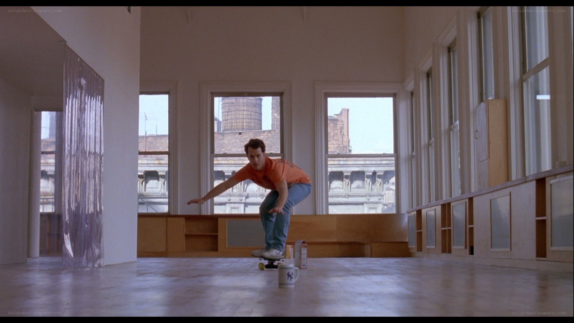 man skateboarding in empty room
