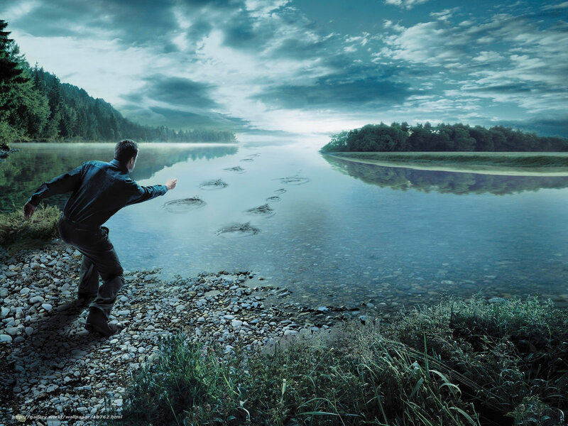 Man skipping stones on a river