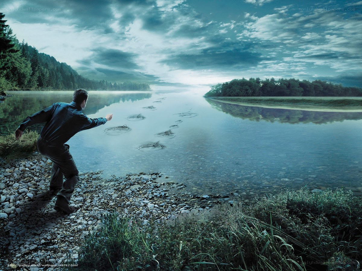 Man skipping stones on a river