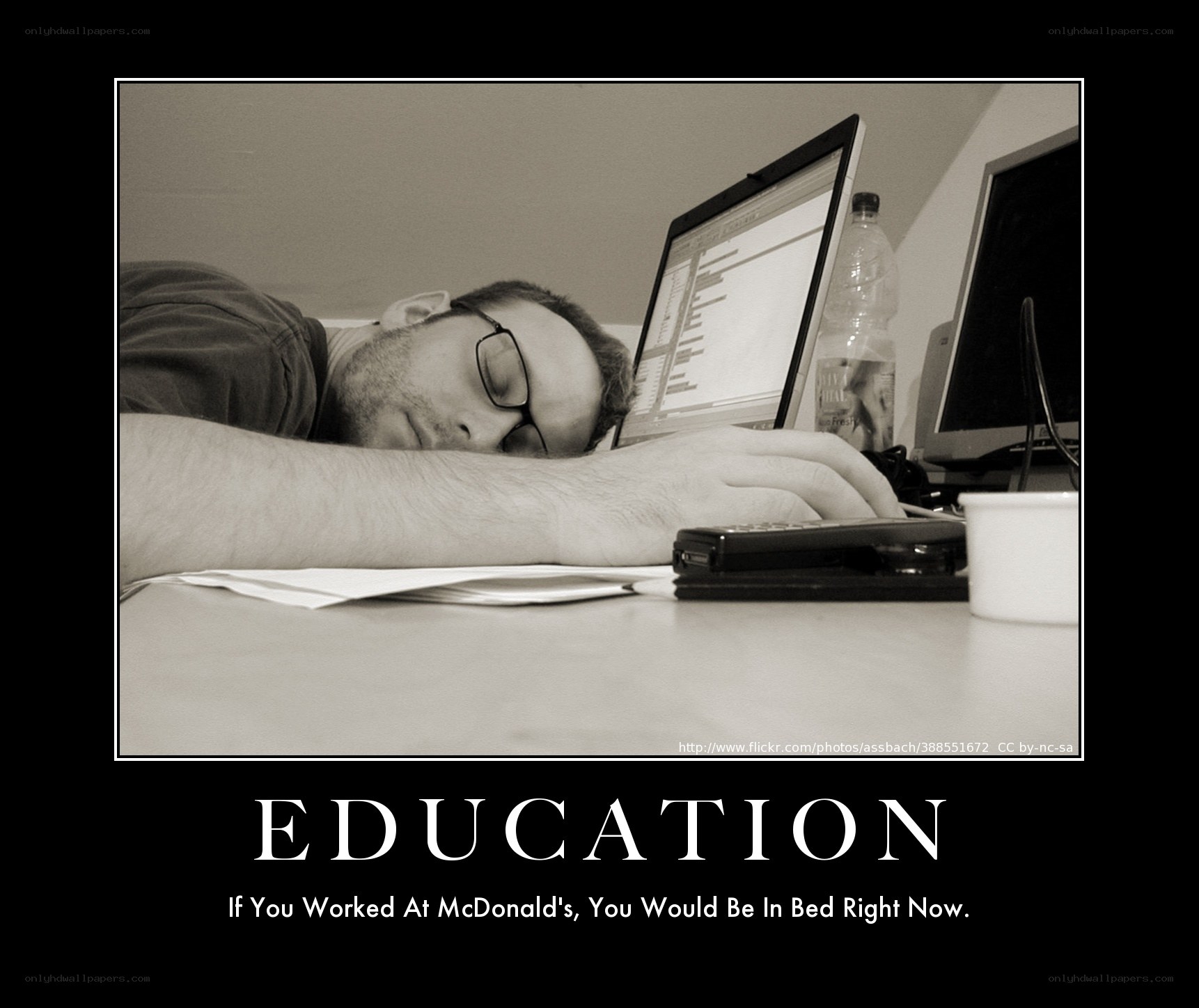 man sleeping at desk