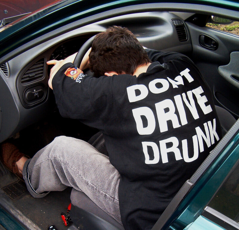 Man Sleeping in Car