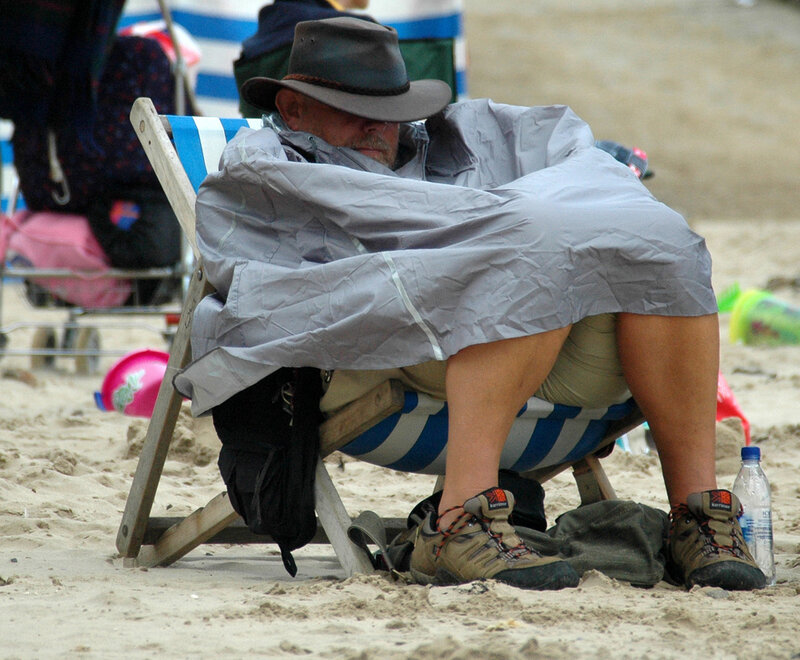 Man Sleeping on Beach