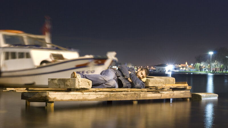 Man Sleeping on Dock