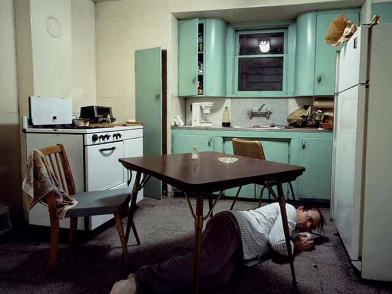 Man sleeping on kitchen floor