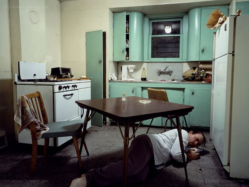 Man sleeping on kitchen floor