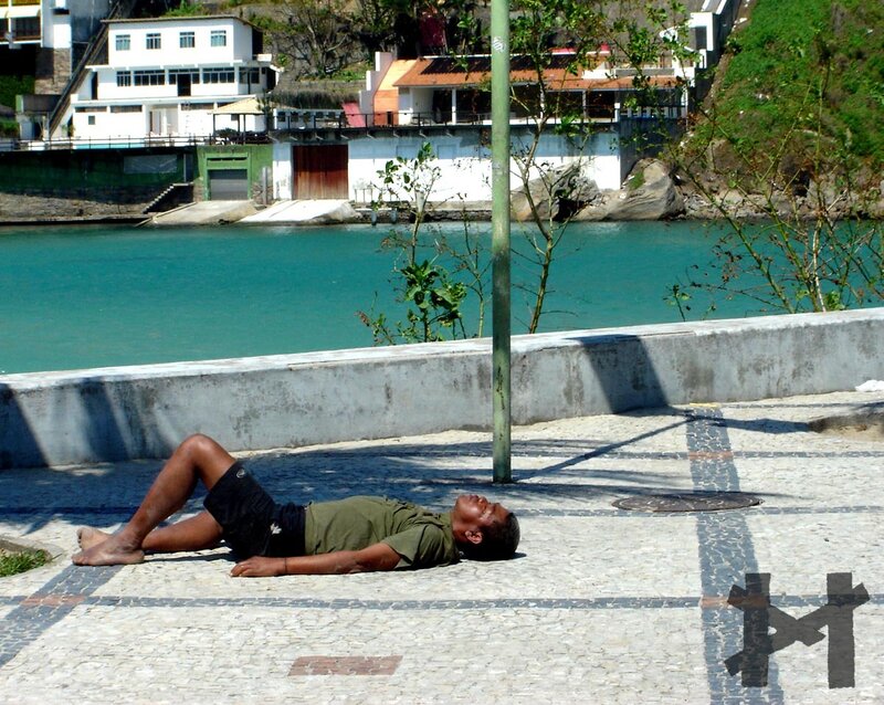 Man Sleeping on Pavement