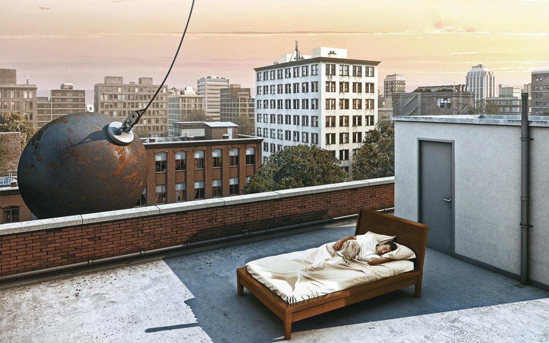 Man sleeping on rooftop with wrecking ball