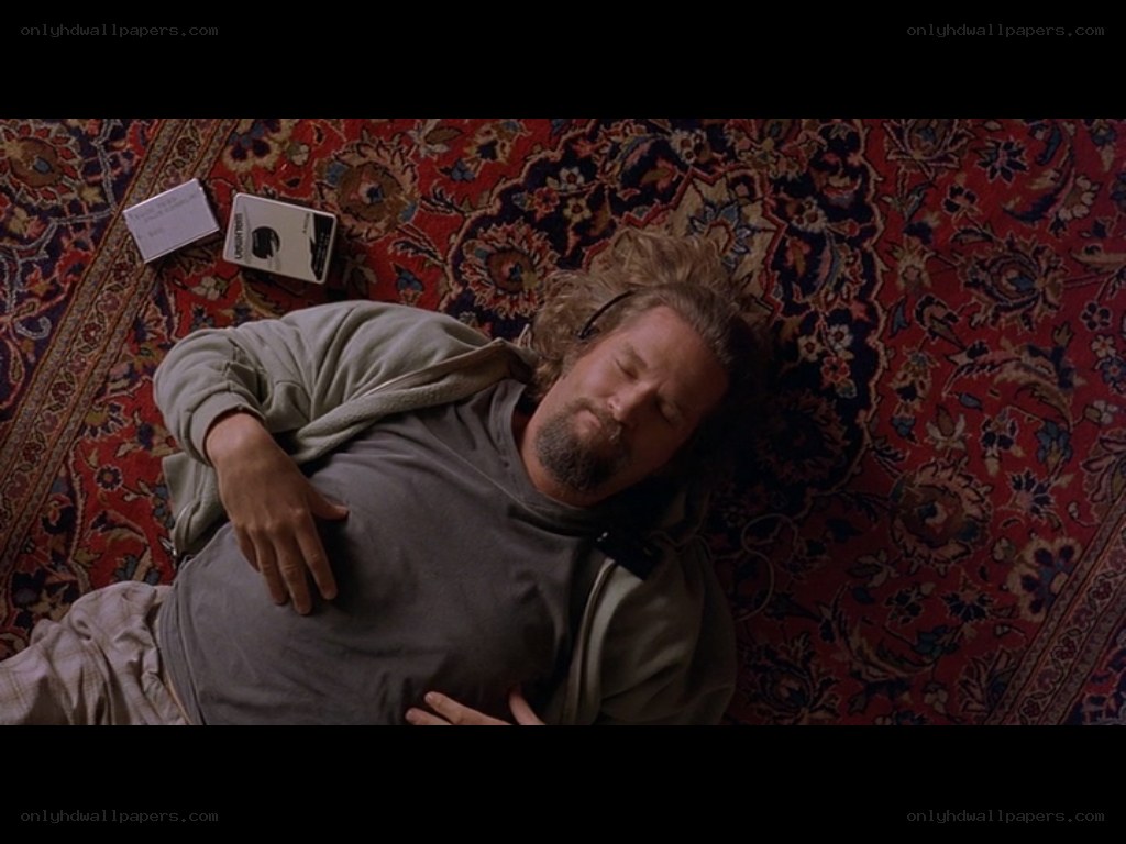 man sleeping on rug