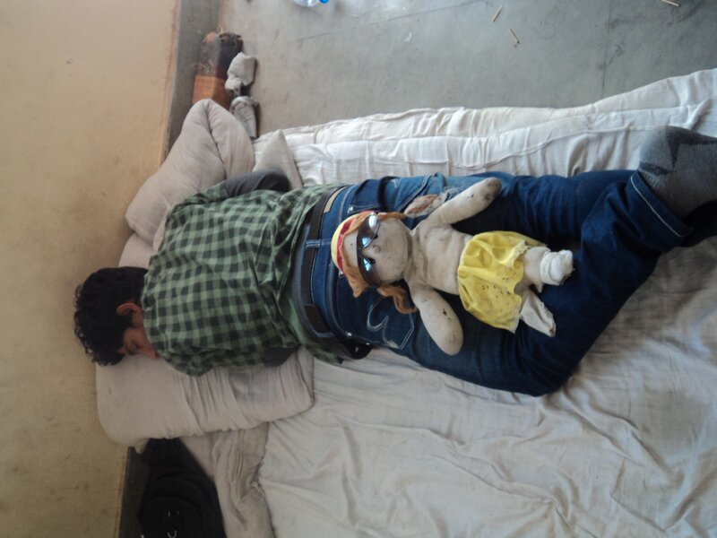 Man sleeping with doll