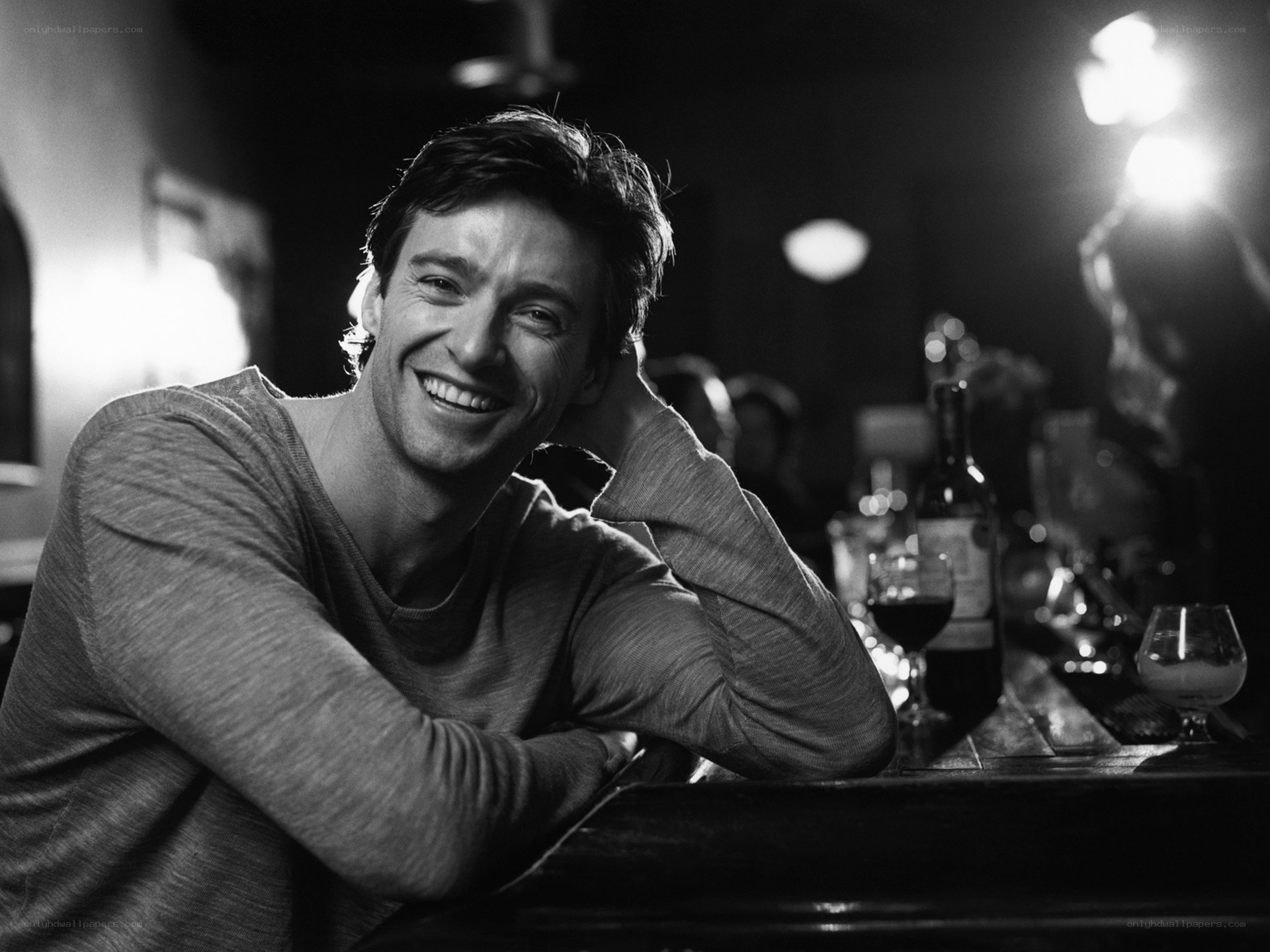 man smiling at bar
