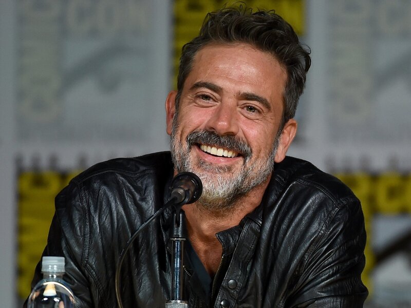 man smiling at panel
