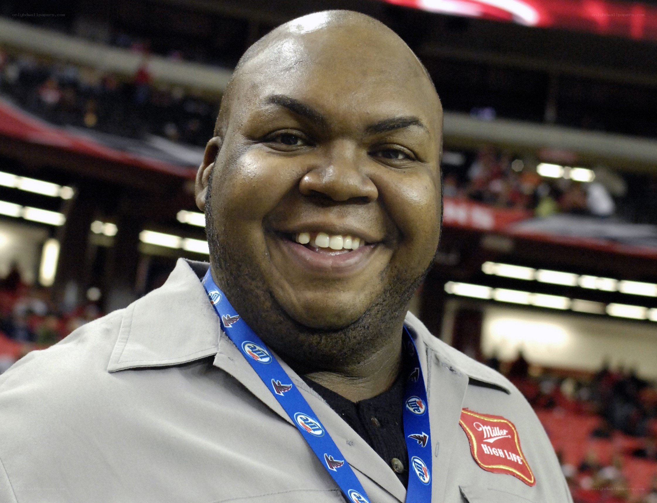 man smiling at stadium