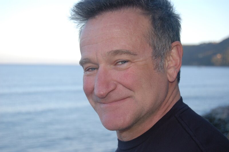 man smiling by the sea