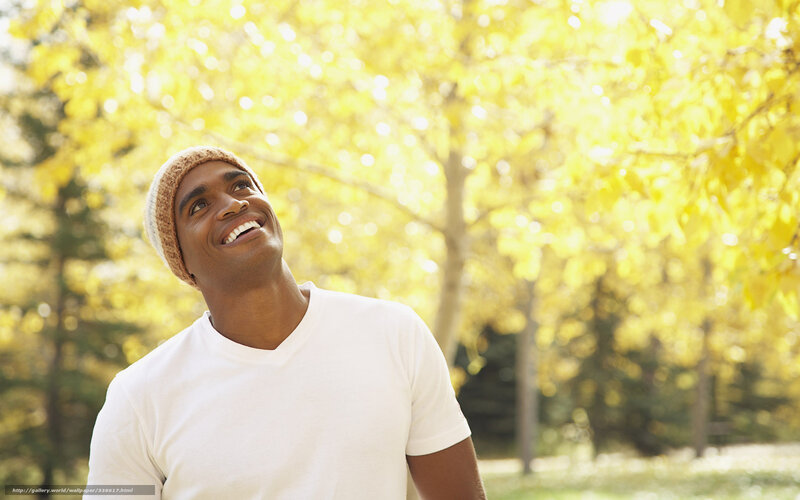 Man smiling in autumn park
