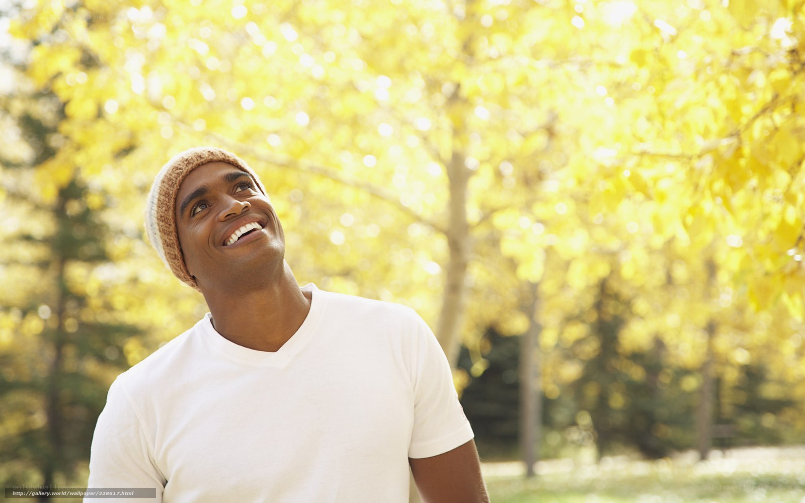 Man smiling in autumn park
