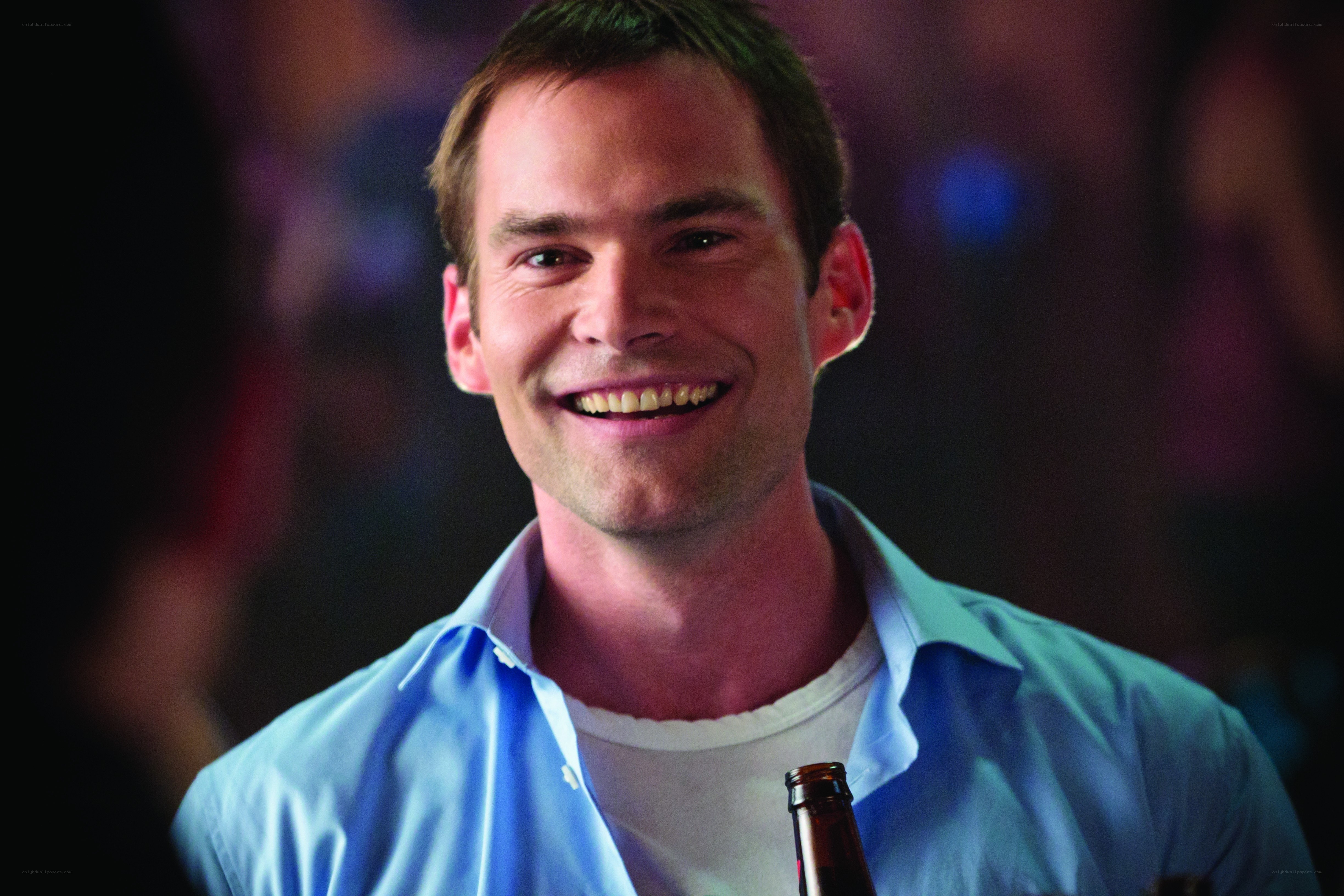 man smiling in bar