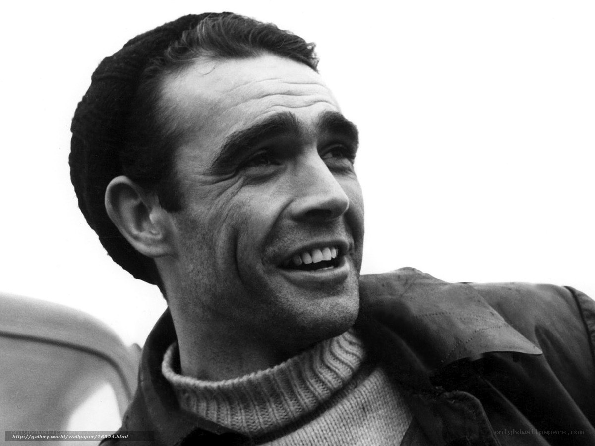 man smiling in black and white