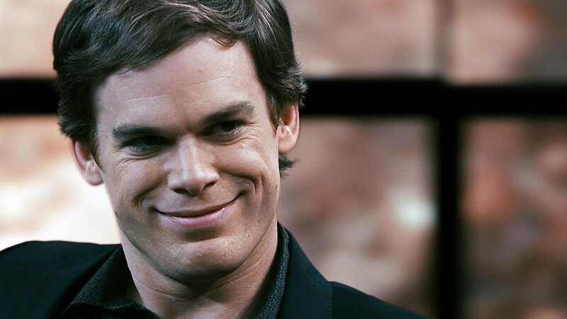 man smiling in black jacket