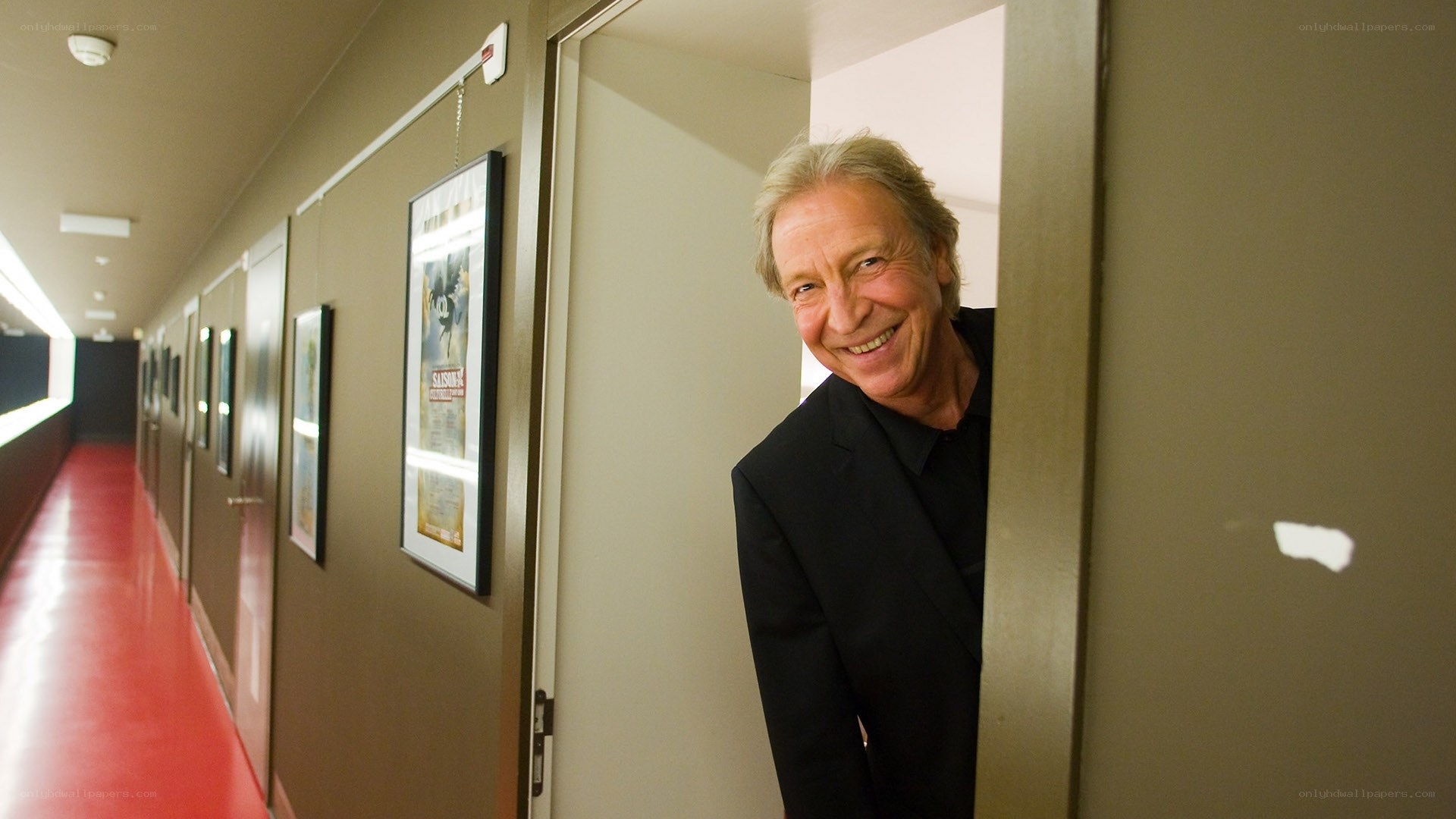 Man smiling in hallway