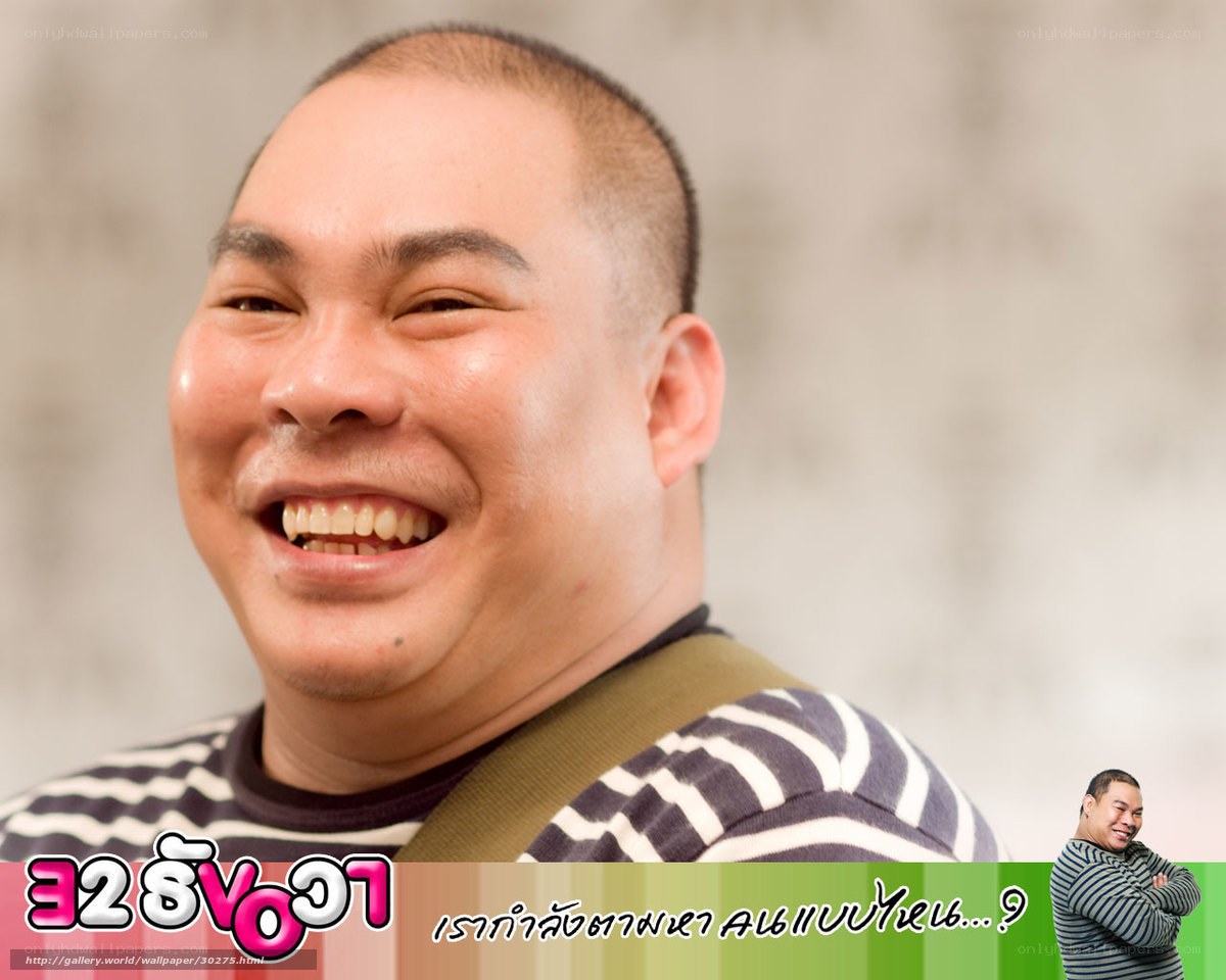 Man smiling in striped shirt