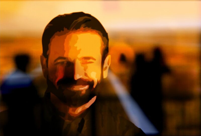 man smiling in warm light