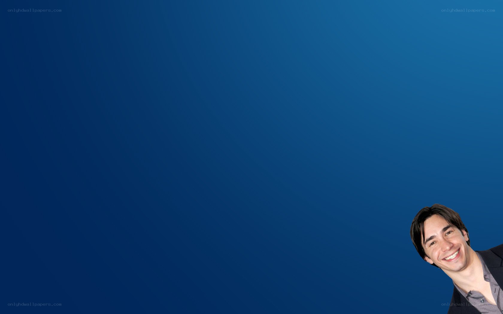 man smiling on blue background