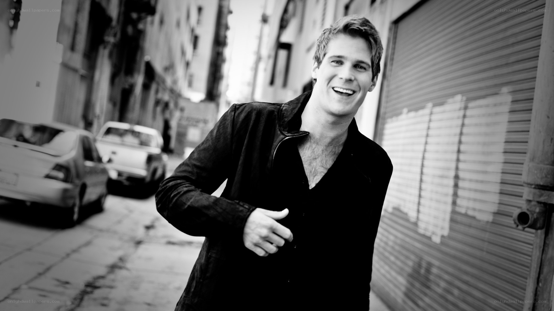 man smiling on city street
