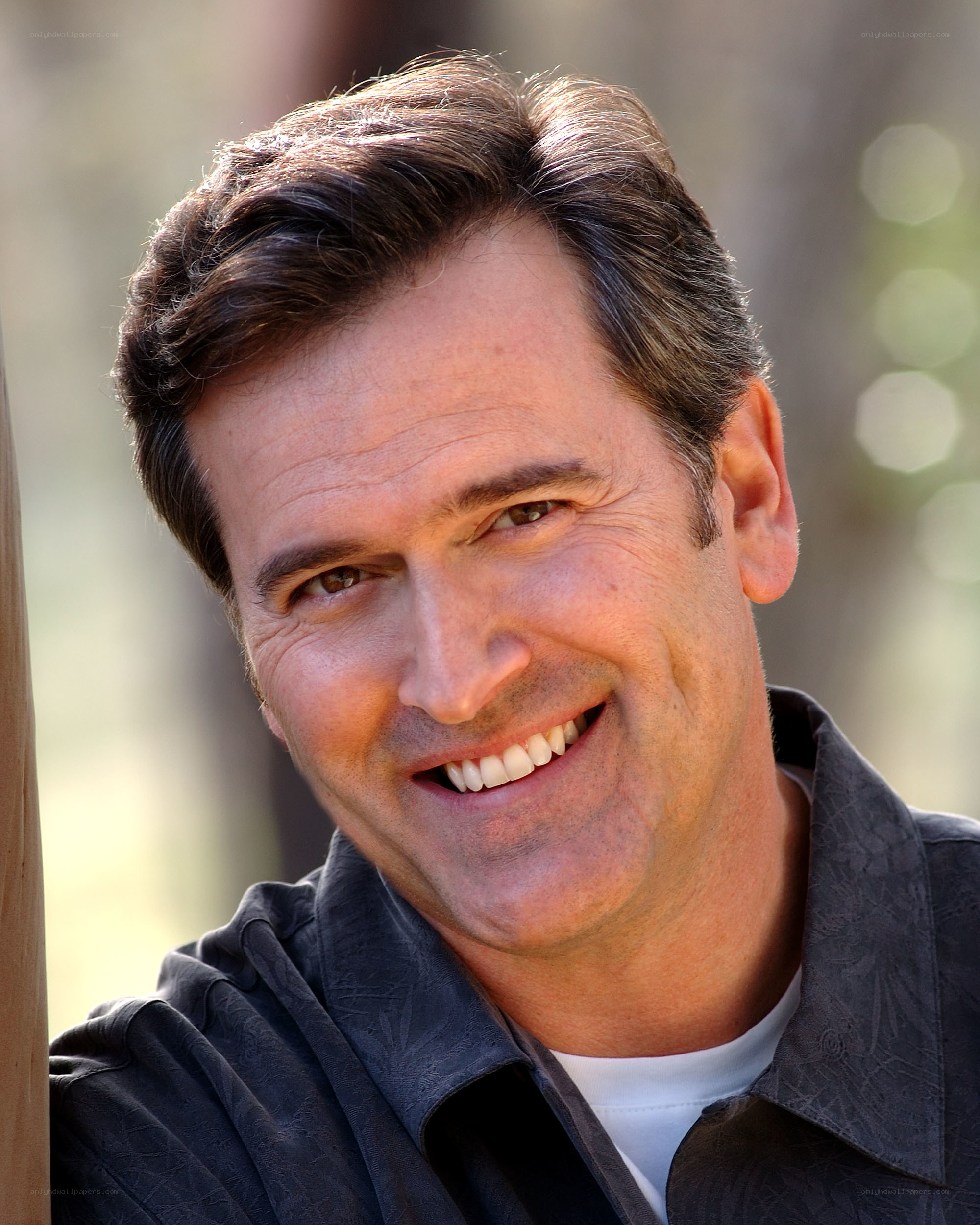 man smiling outdoors