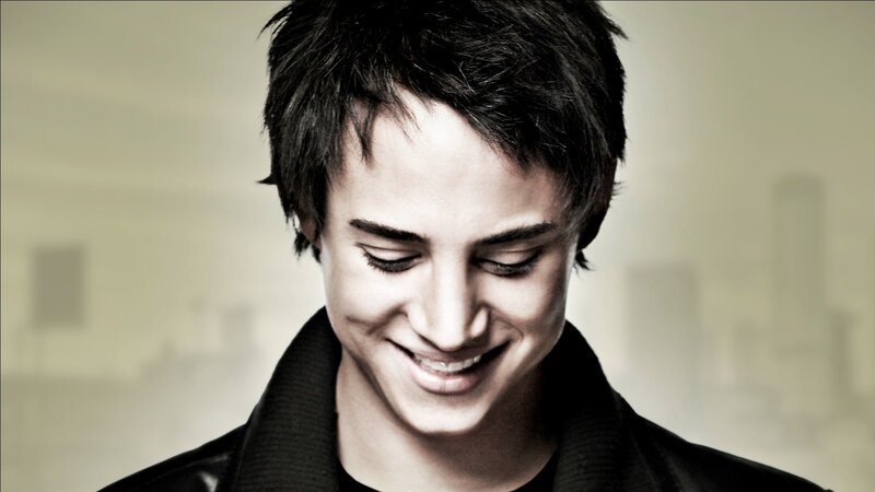 man smiling with eyes closed