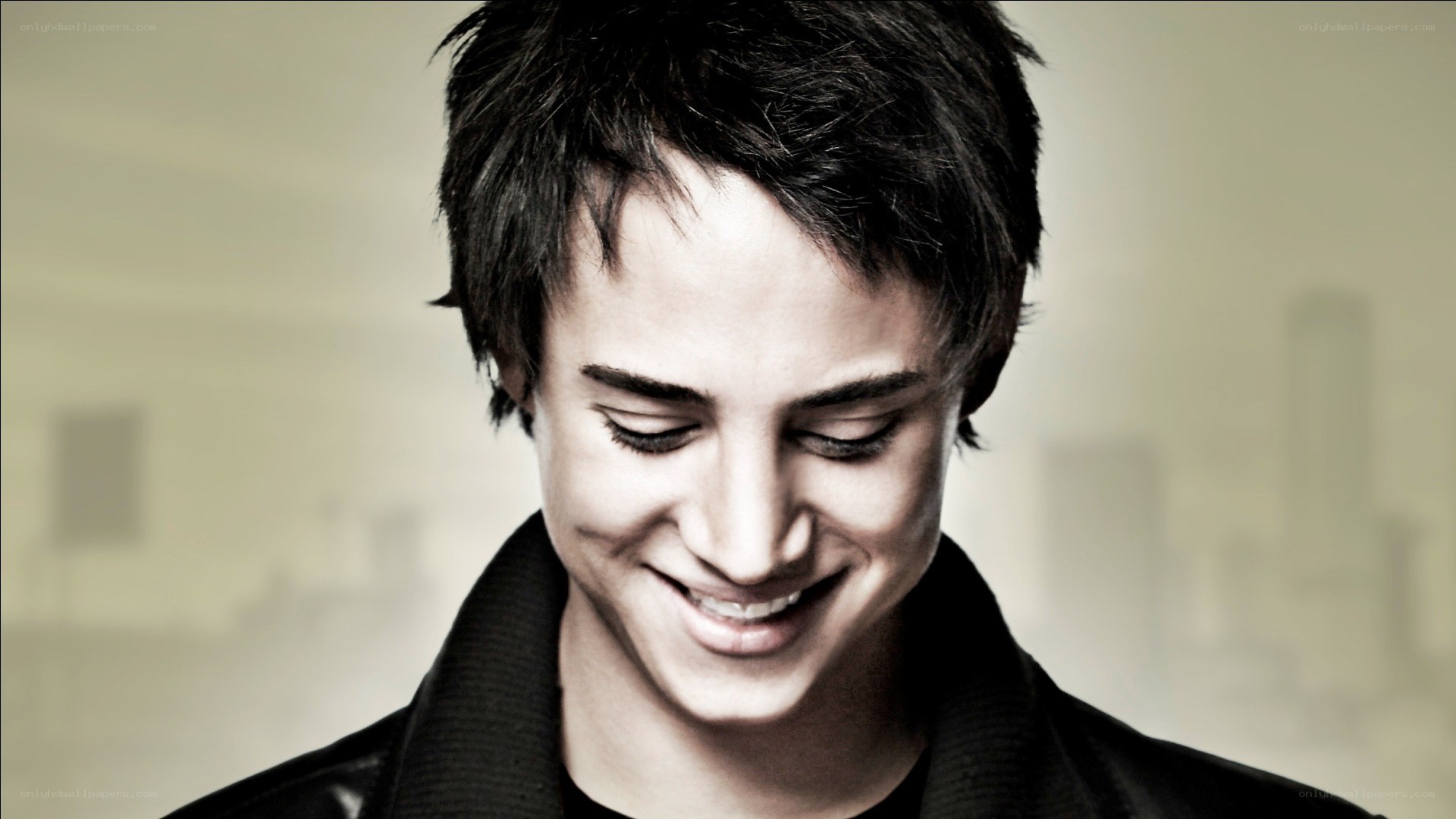 man smiling with eyes closed