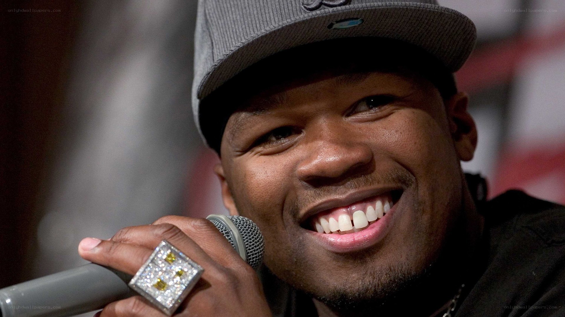 man smiling with microphone