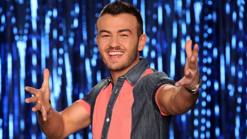 man smiling with open arms