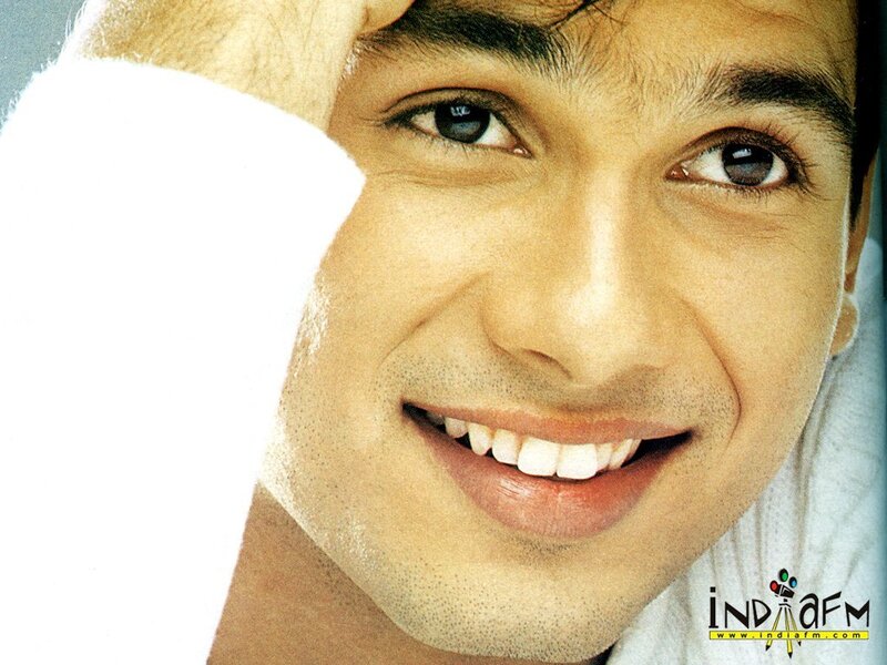 man smiling with towel