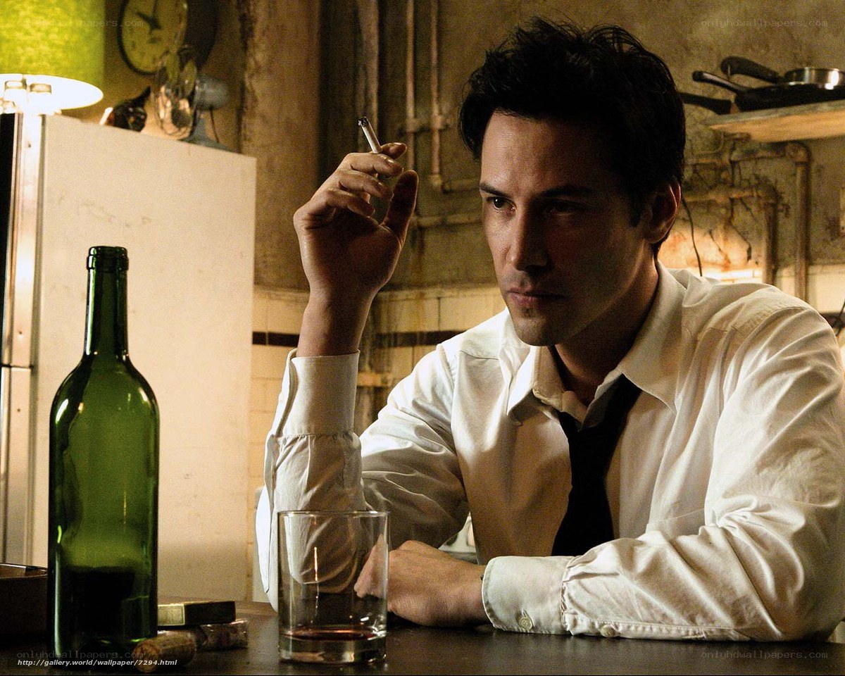 man smoking at a bar