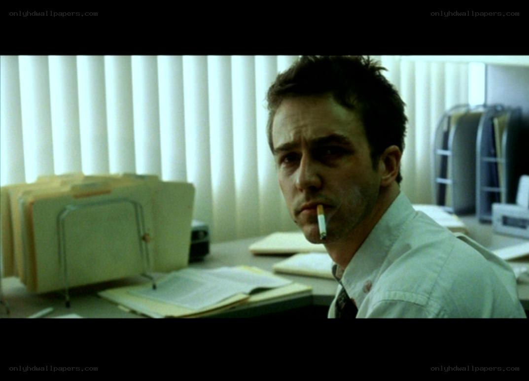 man smoking at office desk