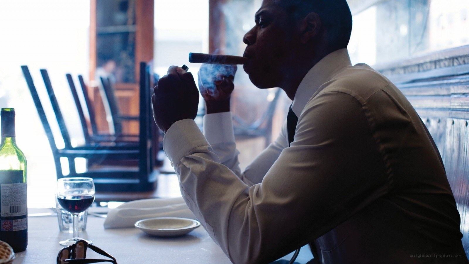 man smoking cigar at restaurant