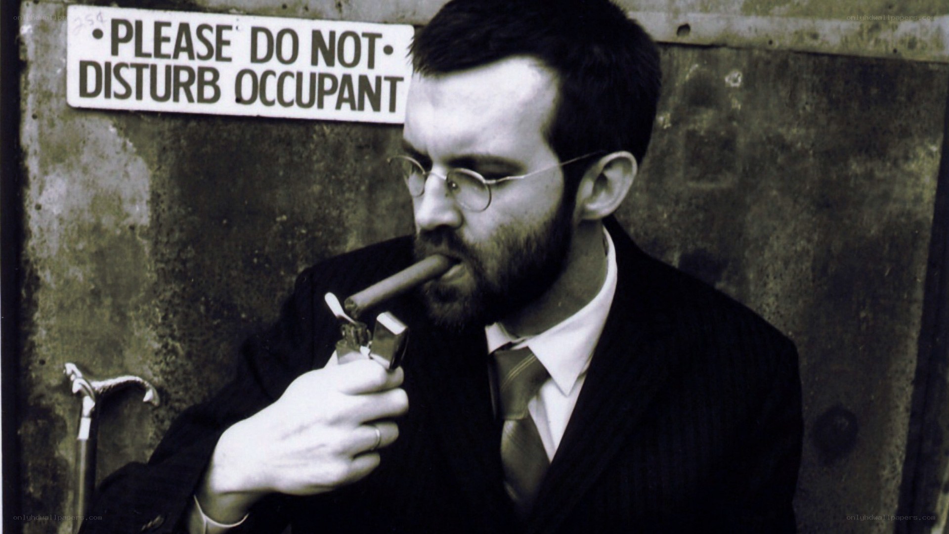 Man smoking cigar in suit