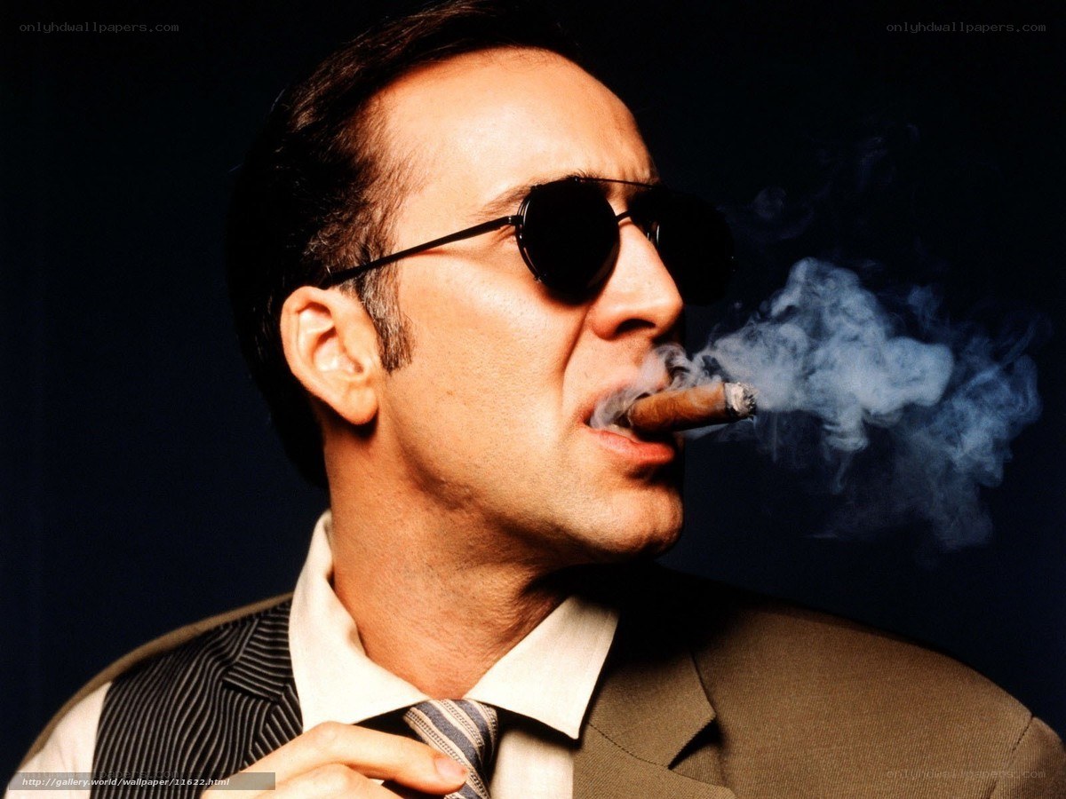 man smoking cigar in suit